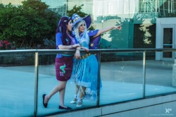 Size: 2048x1365 | Tagged: safe, artist:mieucosplay, artist:sarahndipity cosplay, artist:xen photography, starlight glimmer, trixie, human, g4, cape, clothes, cosplay, costume, duo, facebook, hat, irl, irl human, photo, pointing, trixie's cape, trixie's hat