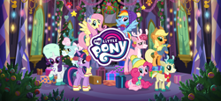 Size: 1666x768 | Tagged: safe, gameloft, alice the reindeer, applejack, aurora the reindeer, bori the reindeer, fluttershy, pinkie pie, rainbow dash, rarity, twilight sparkle, alicorn, deer, earth pony, pegasus, pony, reindeer, unicorn, g4, my little pony best gift ever, my little pony: magic princess, applejack's hat, boots, clothes, cowboy hat, earmuffs, flying, hat, hearth's warming, loading screen, mane six, my little pony logo, new crown, present, rearing, scarf, shoes, sunglasses, the gift givers, twilight sparkle (alicorn), twilight's castle, video game, winter outfit