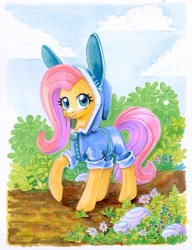 Size: 949x1233 | Tagged: safe, artist:maytee, fluttershy, pegasus, pony, g4, animal costume, bunny costume, bunny ears, bush, clothes, cloud, costume, cute, daaaaaaaaaaaw, dangerous mission outfit, female, flower, goggles, hood, hoodie, looking at you, mare, marker drawing, raised hoof, shyabetes, smiling, solo, traditional art, weapons-grade cute