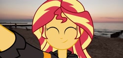 Size: 1920x910 | Tagged: safe, sunset shimmer, equestria girls, g4, beach, equestria girls in real life, eyes closed, hand, irl, ocean, photo, smiling, solo, sunset