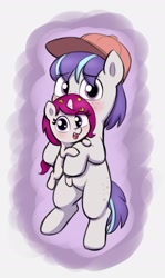 Size: 1209x2025 | Tagged: safe, artist:heretichesh, oc, oc only, earth pony, pony, unicorn, baseball cap, blushing, cap, cute, duo, female, filly, freckles, hat, holding a pony, looking at you, male, ocbetes, stallion