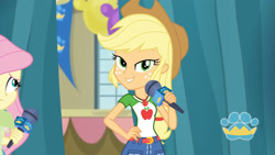 Size: 3410x1920 | Tagged: safe, screencap, applejack, fluttershy, best in show: the pre-show, equestria girls, g4, my little pony equestria girls: better together, applejack's hat, applejack's shirt with a collar, belt, best in show logo, clothes, collar, collar shirt, cowboy hat, cutie mark, cutie mark on clothes, denim skirt, female, freckles, geode of super strength, hair, hand on hip, hat, jewelry, lidded eyes, magical geodes, microphone, necklace, offscreen character, ponytail, shirt, shirt with a collar, skirt, smiling, smirk, t-shirt, teenager