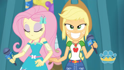 Size: 3410x1920 | Tagged: safe, screencap, applejack, fluttershy, best in show: the pre-show, equestria girls, g4, my little pony equestria girls: better together, applejack's hat, applejack's shirt with a collar, belt, best in show logo, clothes, collar, collar shirt, cowboy hat, cutie mark, cutie mark on clothes, denim skirt, dress, eyes closed, female, freckles, geode of fauna, geode of super strength, grin, hair, hairpin, hat, jewelry, lidded eyes, magical geodes, microphone, necklace, ponytail, shirt, shirt with a collar, skirt, smiling, smirk, t-shirt, teenager