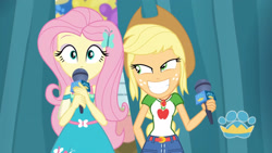Size: 3410x1920 | Tagged: safe, screencap, applejack, fluttershy, best in show: the pre-show, equestria girls, equestria girls series, g4, spoiler:eqg series (season 2), applejack's hat, applejack's shirt with a collar, belt, best in show logo, clothes, collar, collar shirt, cowboy hat, cute, cutie mark, cutie mark on clothes, denim skirt, dress, female, freckles, geode of super strength, grin, hair, hairpin, hat, jackabetes, jewelry, lidded eyes, magical geodes, microphone, necklace, ponytail, shirt, shirt with a collar, shyabetes, skirt, smiling, smirk, t-shirt, teenager