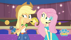 Size: 3410x1920 | Tagged: safe, screencap, applejack, fluttershy, best in show: the victory lap, equestria girls, g4, my little pony equestria girls: better together, applejack's hat, belt, best in show logo, clothes, cowboy hat, cutie mark, cutie mark on clothes, denim skirt, duo, duo female, female, frown, geode of fauna, geode of super strength, gritted teeth, hairpin, hat, high res, jewelry, magical geodes, microphone, necklace, skirt