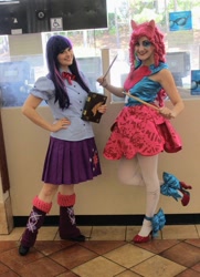 Size: 761x1050 | Tagged: safe, artist:sarahndipity cosplay, artist:shelbeanie, pinkie pie, twilight sparkle, human, equestria girls, g4, my little pony equestria girls: rainbow rocks, 2014, book, book of harmony, clothes, cosplay, costume, drumsticks, hand on hip, irl, irl human, photo