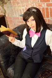 Size: 427x640 | Tagged: safe, octavia melody, human, g4, book, bowtie, clothes, cosplay, costume, irl, irl human, photo, sitting
