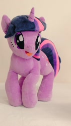 Size: 576x1024 | Tagged: safe, artist:nekokevin, twilight sparkle, pony, unicorn, g4, female, irl, mare, open mouth, photo, plushie, smiling, solo, unicorn twilight