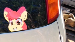 Size: 3120x1755 | Tagged: safe, artist:partypievt, apple bloom, earth pony, pony, g4, car, female, filly, grin, irl, looking back, peeking, photo, smiling, sticker