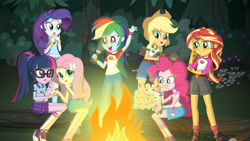 Size: 1280x720 | Tagged: safe, applejack, fluttershy, pinkie pie, rainbow dash, rarity, sci-twi, sunset shimmer, twilight sparkle, equestria girls, g4, my little pony equestria girls: legend of everfree, official, applejack's hat, camp everfree, camp everfree outfits, campfire, clothes, converse, cowboy hat, cute, denim shorts, eating, female, fire, flashlight (object), food, forest, freckles, glasses, hat, humane five, humane seven, humane six, marshmallow, netflix, open mouth, promotional art, shoes, shorts, skirt, socks, stetson