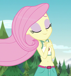 Size: 564x600 | Tagged: safe, edit, edited screencap, screencap, fluttershy, human, equestria girls, g4, my little pony equestria girls: legend of everfree, beautiful, belly button, belt, clothes, cloud, cropped, eyes closed, forest background, hand on chest, midriff, pretty, shorts, sky, smiling, tank top, tree, wind blowing
