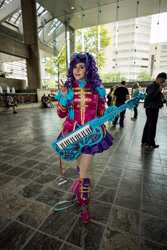Size: 4000x6000 | Tagged: safe, artist:mieucosplay, rarity, human, bronycon, bronycon 2017, equestria girls, friendship through the ages, g4, ancient wonderbolts uniform, clothes, cosplay, costume, irl, irl human, keytar, musical instrument, peace sign, photo, sgt. rarity