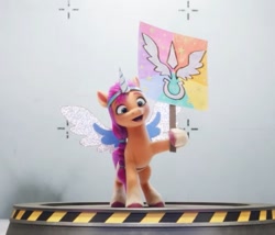 Size: 612x524 | Tagged: safe, screencap, sunny starscout, earth pony, pony, g5, my little pony: a new generation, 3d, alicorn costume, costume, cute, fake horn, fake wings, female, mare, sign, sunnybetes