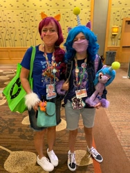 Size: 1536x2048 | Tagged: safe, artist:dusty_kat, izzy moonbow, sunny starscout, human, everfree northwest, g5, clothes, cosplay, costume, everfree northwest 2021, irl, irl human, photo, plushie