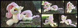 Size: 4755x1754 | Tagged: safe, artist:peruserofpieces, fluttershy, bat pony, pegasus, pony, g4, bat ponified, bat wings, beanie (plushie), fangs, female, flutterbat, irl, looking at you, lying down, mare, photo, plushie, prone, race swap, solo, sploot, tree, wings