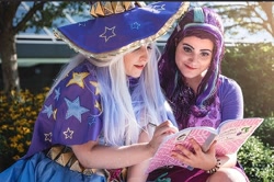 Size: 2048x1362 | Tagged: safe, artist:mieucosplay, artist:sarahndipity cosplay, starlight glimmer, human, g4, cape, clothes, cosplay, costume, duo, hat, irl, irl human, photo, reading, trio, trixie's cape, trixie's hat