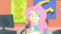 Size: 3410x1920 | Tagged: safe, screencap, fluttershy, equestria girls, equestria girls series, fluttershy's butterflies, g4, computer, female, fluttershy's butterflies: rainbow dash, geode of fauna, hairpin, high res, jewelry, magical geodes, microphone, mug, necklace, open mouth, shrunken pupils, solo