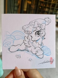 Size: 1536x2048 | Tagged: safe, artist:paipaishuaige, cozy glow, pegasus, pony, g4, bow, looking at you, lying down, photo, sketch, smiling, solo, traditional art