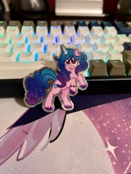 Size: 3024x4032 | Tagged: safe, artist:redpalette, izzy moonbow, pony, unicorn, g5, my little pony: a new generation, cute, etsy, happy, hind legs, irl, keyboard, merchandise, photo, rgb, smiling, sparkle, sparkles, sticker