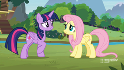 Size: 1920x1080 | Tagged: safe, screencap, fluttershy, twilight sparkle, alicorn, pegasus, pony, g4, memnagerie, my little pony: friendship is forever, 9now, duo, duo female, female, folded wings, mare, outdoors, raised hoof, river, sweet feather sanctuary, twilight sparkle (alicorn), water, wings