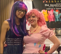 Size: 1460x1298 | Tagged: safe, artist:meihoshi, pinkie pie, twilight sparkle, human, g4, big apple ponycon, clothes, cosplay, costume, cutie mark on clothes, glasses, hand on hip, irl, irl human, jewelry, necklace, photo