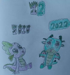 Size: 436x468 | Tagged: safe, artist:mr.myoozik, derpibooru exclusive, sparky sparkeroni, spike, dragon, mlp fim's twelfth anniversary, g5, my little pony: a new generation, amazed, anniversary, anniversary art, baby, baby dragon, fire, green eyes, green fire, green skin, horns, looking up, male, male dragon, numbers, outstretched arms, purple eyes, purple skin, scales, sitting, smoke, sparky and his hero, spread wings, text, traditional art, winged spike, wings