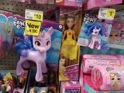 Size: 4000x3000 | Tagged: safe, izzy moonbow, human, pony, unicorn, g5, belle, disney, dollar general, hasbro, hasbro logo, irl, logo, lol surprise, merchandise, my little pony logo, peeps, photo, price tag, self paradox, self ponidox, size comparison, size difference, solo, toy