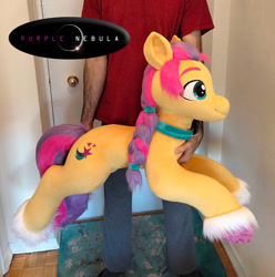 Size: 765x770 | Tagged: safe, artist:purplenebulastudios, sunny starscout, earth pony, human, pony, g5, irl, irl human, lying down, photo, plushie, prone