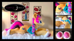 Size: 1280x709 | Tagged: safe, artist:purplenebulastudios, sunny starscout, earth pony, pony, g5, irl, lying down, photo, plushie, prone