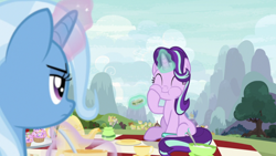 Size: 1334x750 | Tagged: safe, screencap, starlight glimmer, trixie, pony, unicorn, g4, student counsel, cup, cupcake, duo, duo female, eating, eyes closed, female, food, glowing, glowing horn, herbivore, horn, magic, mare, picnic blanket, ponyville, sandwich, teacup, teapot, telekinesis