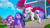 Size: 2388x1339 | Tagged: safe, screencap, izzy moonbow, pipp petals, zipp storm, pegasus, pony, unicorn, g5, my little pony: make your mark, my little pony: make your mark chapter 2, the cutie mark mix-up, spoiler:g5, bush, cellphone, distracted, female, flower, flying, hoof pointing, mare, phone, royal sisters (g5), siblings, sidewalk, sisters, tree, trio