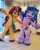 Size: 750x937 | Tagged: safe, izzy moonbow, sunny starscout, earth pony, human, pony, unicorn, g5, official, 2022, bag, fursuit, irl, irl human, mascot, mascot costume, new york city, outstretched arms, paley center, paleywknd, photo, raised hoof, smiling, wide hips