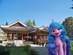 Size: 720x541 | Tagged: safe, edit, vector edit, izzy moonbow, pony, unicorn, g5, building, female, haeju, irl, korea, mare, north korea, photo, ponies in real life, stock render