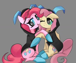 Size: 1500x1232 | Tagged: safe, artist:solid shrimp, fluttershy, pinkie pie, earth pony, pegasus, pony, g4, bunny ears, clothes, costume, dangerous mission outfit, duo, female, goggles, hoodie, hug, mare, matching outfits, pinktober, simple background, stealth suit