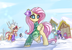 Size: 4096x2854 | Tagged: safe, artist:jfrxd, fluttershy, starlight glimmer, oc, pegasus, pony, unicorn, beanie, clothes, cute, earmuffs, hat, heterochromia, photo, ponyville, raised hoof, scarf, smiling, snow, snowball, snowball fight, winter, winter outfit