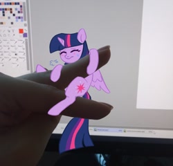Size: 780x750 | Tagged: safe, artist:polyblank, twilight sparkle, alicorn, human, pony, g4, clinging, computer screen, eyes closed, hand, human and pony, irl, irl human, monitor, photo, solo focus, tiny, tiny ponies, twilight sparkle (alicorn)