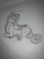 Size: 3024x4032 | Tagged: safe, artist:lotustrails, fluttershy, pegasus, pony, g4, flower, flower in hair, grayscale, lying down, monochrome, pencil drawing, solo, traditional art