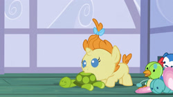 Size: 3072x1727 | Tagged: safe, screencap, pumpkin cake, pony, unicorn, baby cakes, g4, season 2, baby, baby pony, doll, female, filly, foal, high res, mouth hold, solo, toy