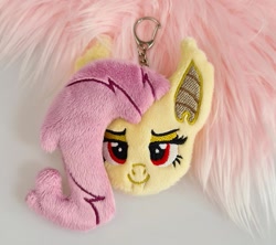 Size: 1077x956 | Tagged: safe, artist:meplushyou, fluttershy, bat pony, g4, bat ponified, charm, fangs, flutterbat, irl, keychain, photo, plushie, race swap, smiling, solo