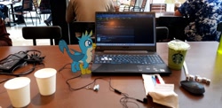 Size: 1776x864 | Tagged: safe, gameloft, photographer:horsesplease, gallus, g4, augmented reality, birb, computer, dice, earbuds, laptop computer, malaysia, micro, solo, starbucks
