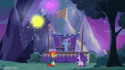 Size: 360x202 | Tagged: safe, edit, edited screencap, screencap, starlight glimmer, sunburst, trixie, pony, unicorn, g4, season 7, uncommon bond, animated, bipedal, brooch, cape, chest, cloak, clothes, cute, diatrixes, eyes closed, female, fireworks, gif, glasses, hat, hind legs, imgflip, jewelry, lights, looking at someone, magic, magic show, male, mare, one eye closed, raised hoof, reversed, sitting, stage, stallion, standing on two hooves, stars, sunburst's cloak, tree, trio, trixie's brooch, trixie's cape, trixie's hat, trixie's wagon, wagon, wink