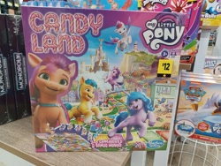 Size: 4000x3000 | Tagged: safe, hitch trailblazer, izzy moonbow, phyllis cloverleaf, pipp petals, sunny starscout, zipp storm, earth pony, pegasus, pony, unicorn, g5, official, badge, bag, board game, candy land, chase (paw patrol), crossover, dollar general, female, game, hasbro, hasbro logo, high res, irl, lighthouse, logo, male, mane five, mare, maretime bay, marinette dupain-cheng, merchandise, miraculous ladybug, monopoly, my little pony logo, nickelodeon, paw patrol, photo, satchel, simple background, stallion