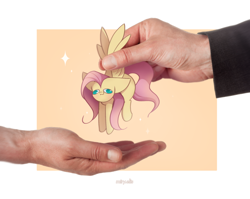 Size: 1600x1275 | Tagged: safe, artist:miryelis, fluttershy, human, pegasus, pony, g4, big ears, derp, full body, hand, hanging, impossibly large ears, irl, irl human, meme, micro, photo, shitposting, signature, simple background, smiling, smol, solo, tiny, tiny ponies, wing hold, wings