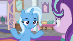Size: 1764x993 | Tagged: safe, screencap, starlight glimmer, trixie, pony, unicorn, a horse shoe-in, g4, duo, duo female, female, frown, grin, lidded eyes, looking at each other, looking at someone, mare, shrug, smiling
