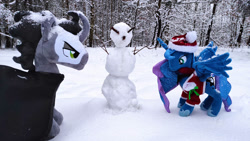 Size: 1192x670 | Tagged: safe, king sombra, princess luna, alicorn, pony, unicorn, g4, christmas, clothes, duo, forest, holiday, irl, mgrdash, photo, plushie, snow, snowman, winter, winter outfit