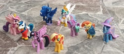 Size: 3580x1558 | Tagged: safe, artist:dingopatagonico, princess cadance, princess celestia, princess luna, starlight glimmer, sunburst, sunset shimmer, trixie, twilight sparkle, alicorn, pony, unicorn, g4, photo, toy, twilight sparkle (alicorn)