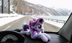 Size: 2048x1225 | Tagged: safe, photographer:pakapaka1993, starlight glimmer, pony, unicorn, g4, car, car interior, irl, japan, photo, plushie, snow, solo, tongue out, winter