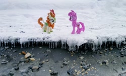 Size: 1024x618 | Tagged: safe, photographer:pakapaka1993, autumn blaze, berry punch, berryshine, earth pony, kirin, pony, g4, duo, icicle, irl, japan, photo, plushie, rock, snow, winter