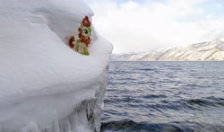 Size: 2048x1201 | Tagged: safe, photographer:pakapaka1993, autumn blaze, kirin, pony, g4, icicle, irl, japan, mountain, ocean, photo, plushie, snow, solo, water, winter