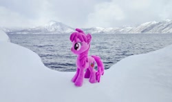 Size: 1024x605 | Tagged: safe, photographer:pakapaka1993, berry punch, berryshine, earth pony, pony, g4, irl, japan, mountain, ocean, photo, plushie, snow, solo, water, winter